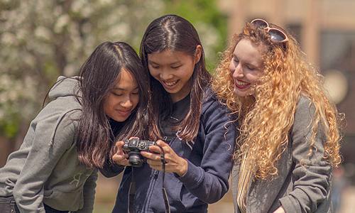 three 威尼斯游戏大厅 students looking at a camera.